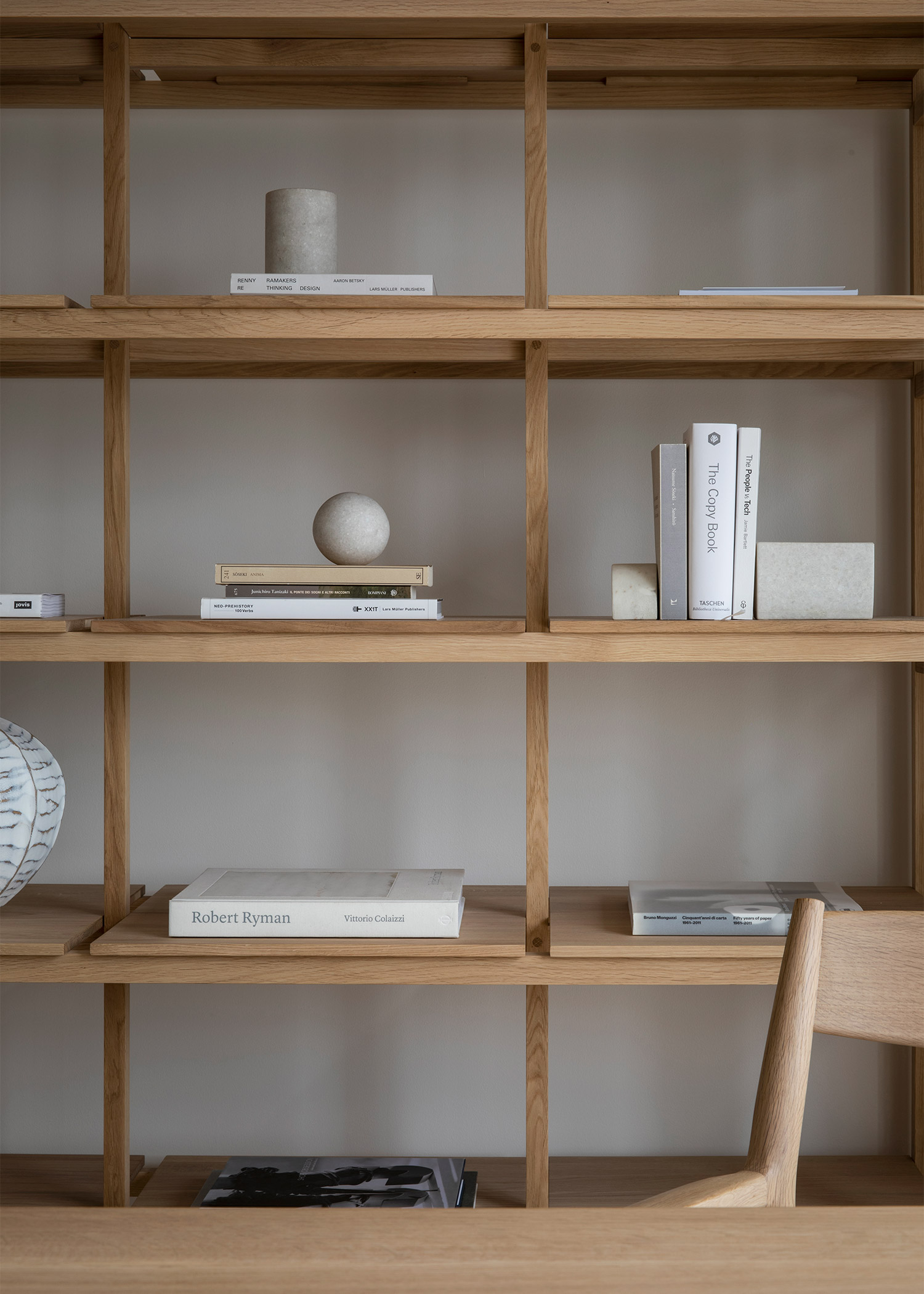 minimal solid oak shelving in a calm home
