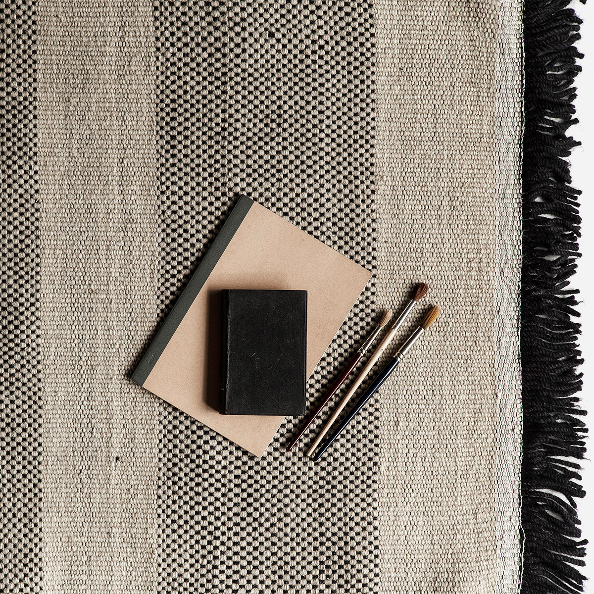 flat hand woven Dhurrie rug in natural and black