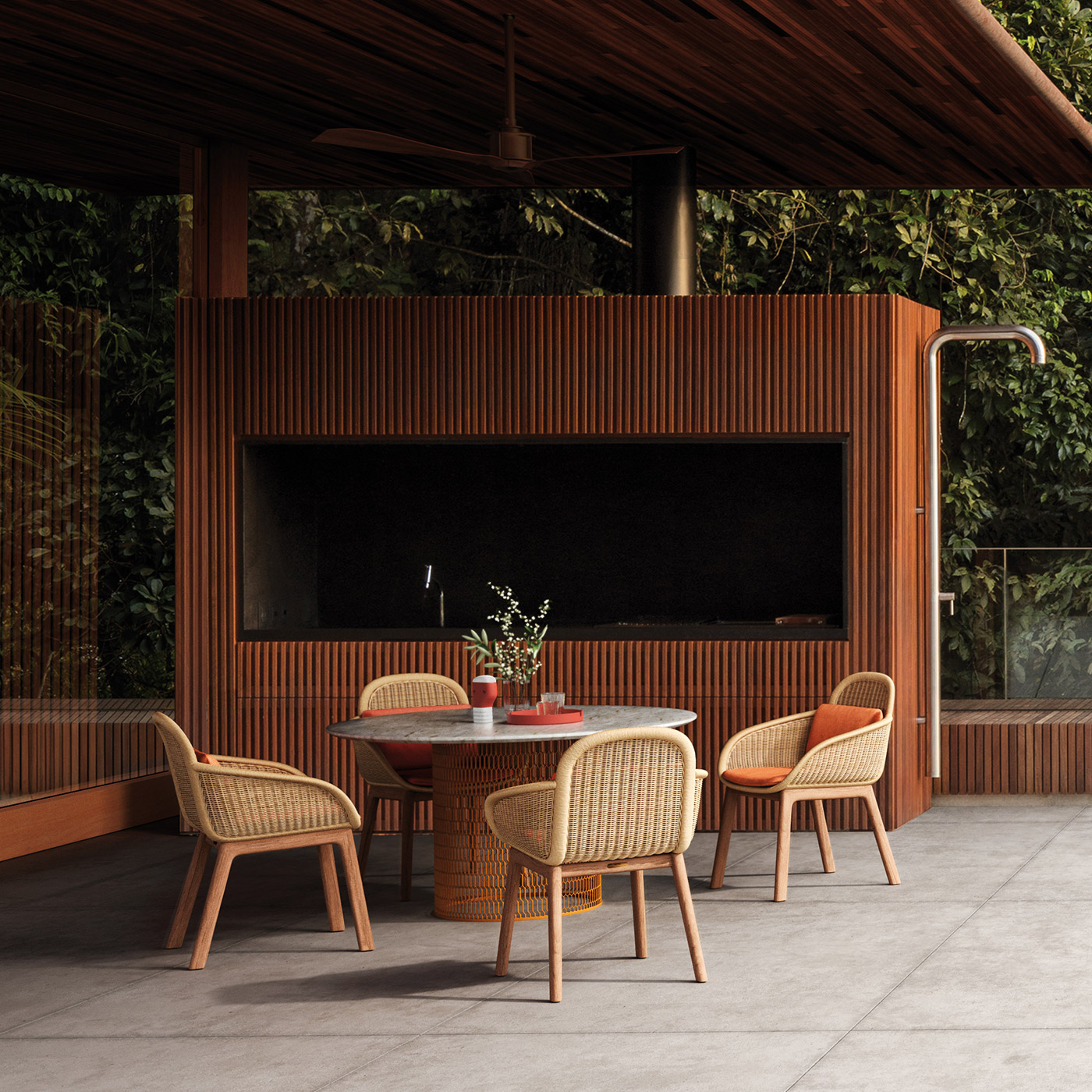 Modern cane outdoor dining chairs with mesh metal outdoor dining table next to modern teak house in Indonesia