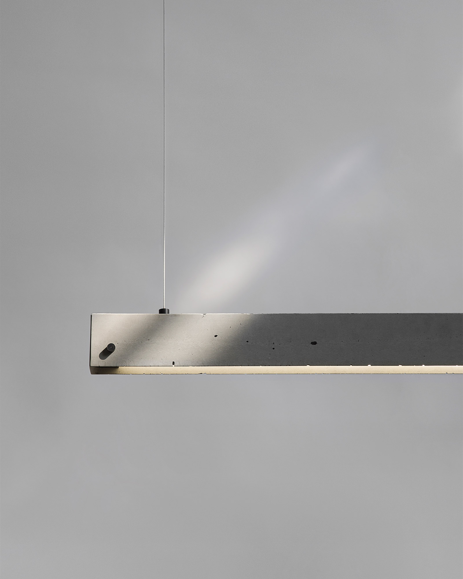 concrete pendant strip light on fine wires
