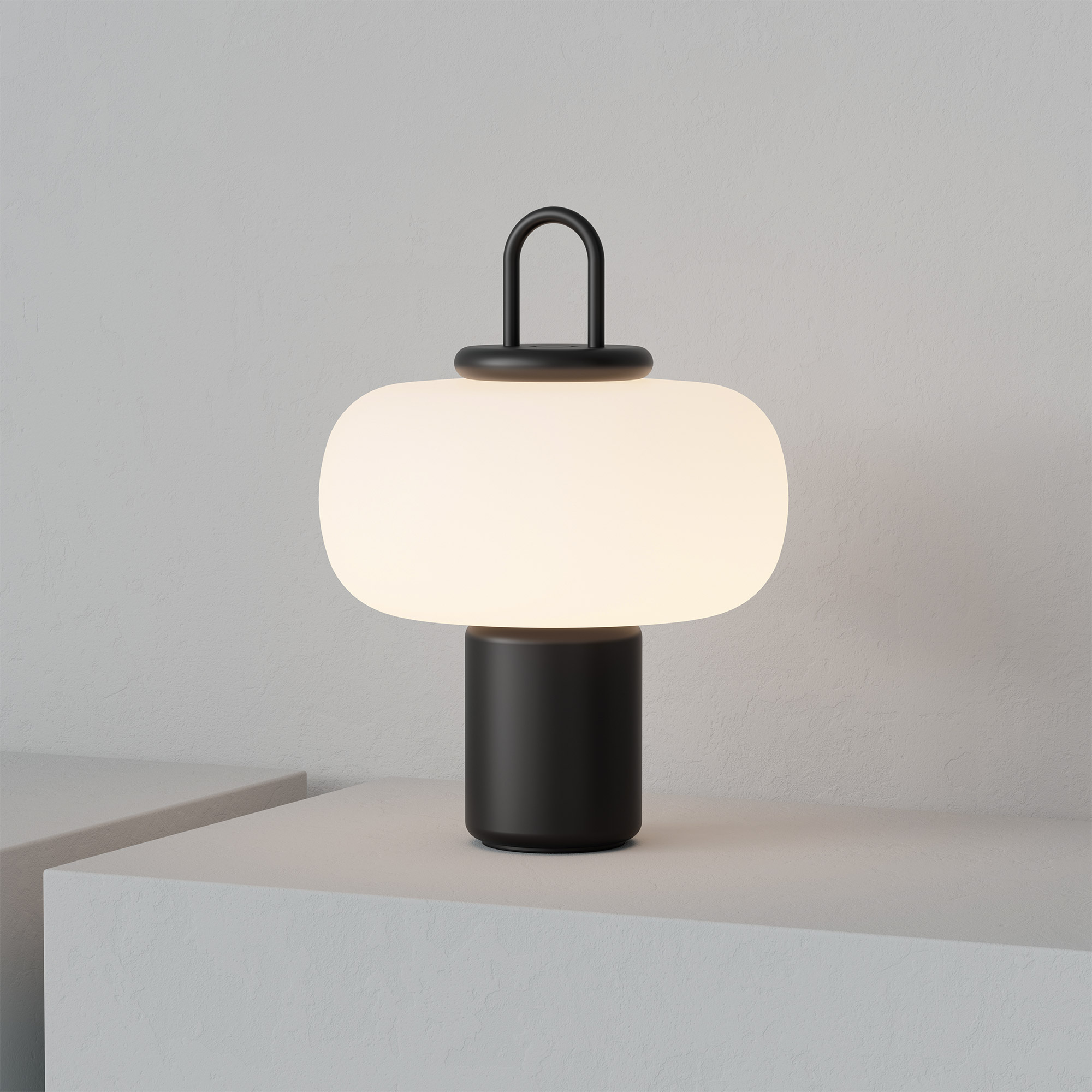 Nox table lamp by Astep in black on grey plinth