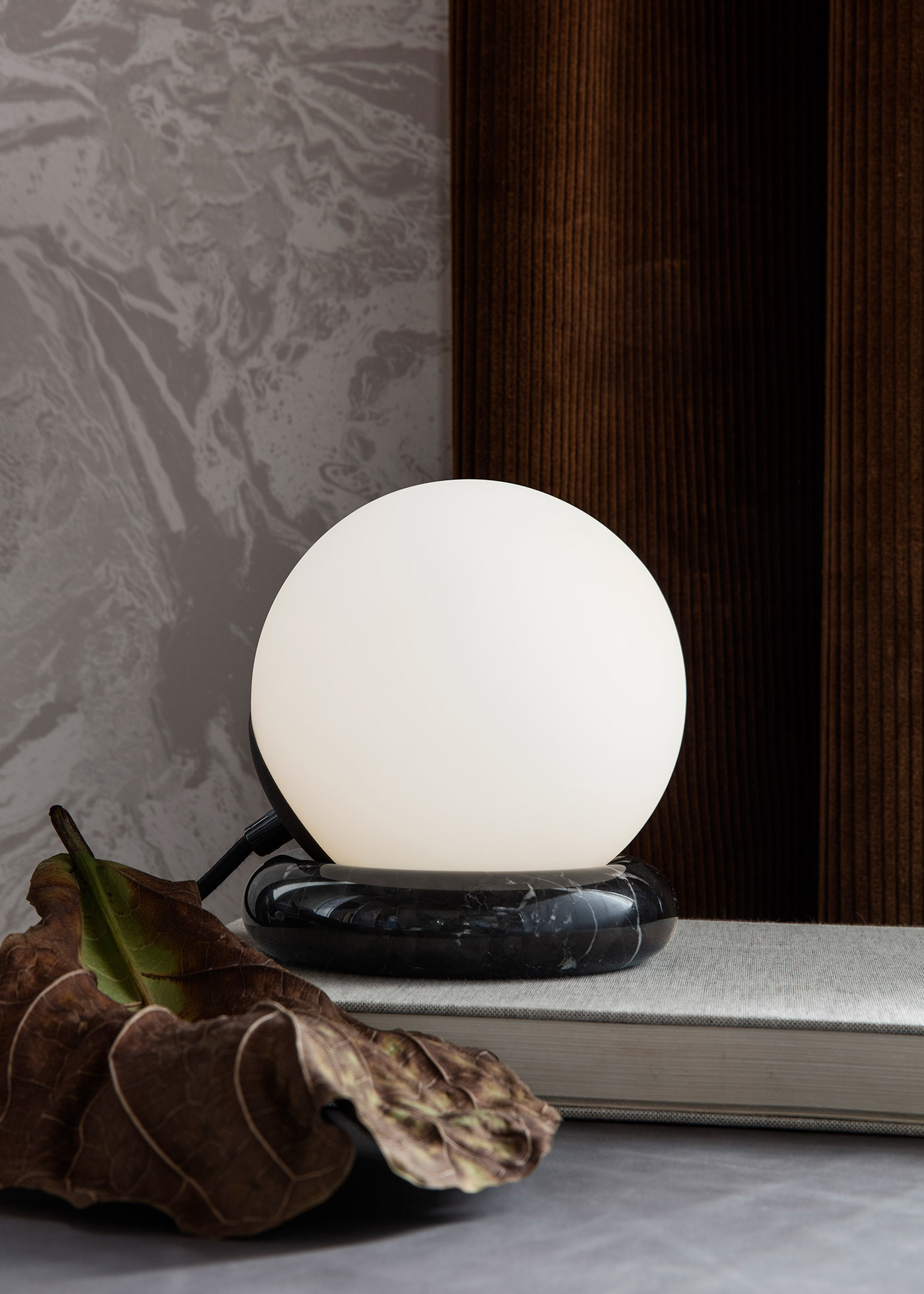 Rest side lamp by Ferm Living on windowsill