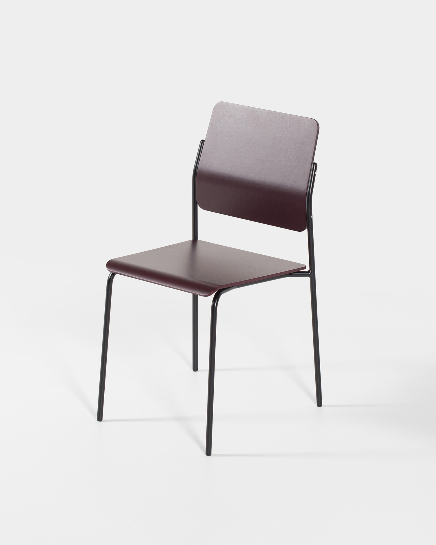 Burgundy plywood and black tubular steel stackable chair
