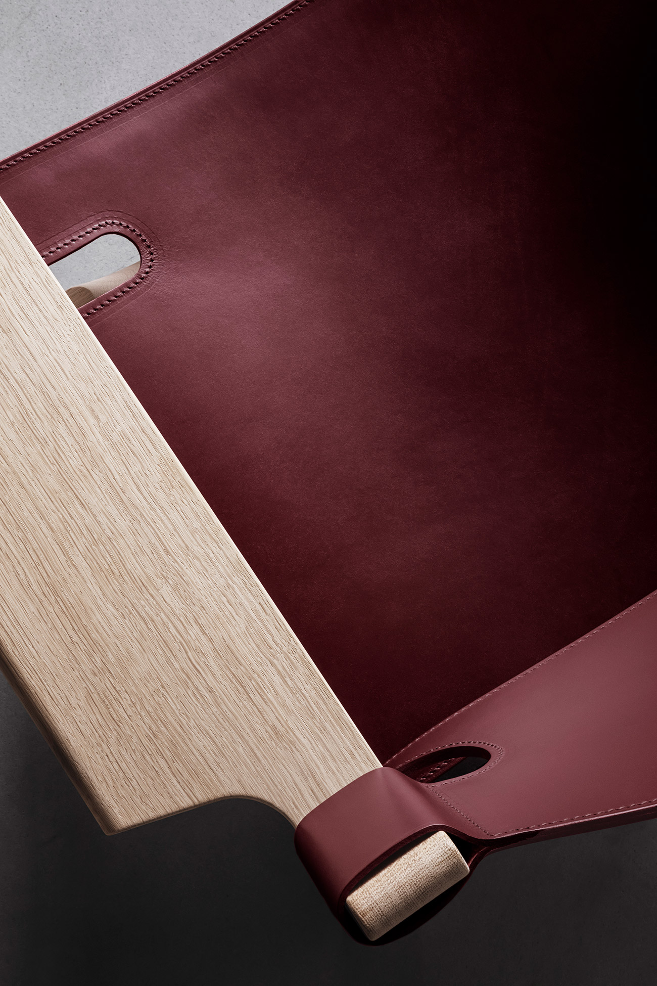 Detail of Spanish Chair in deep red by Fredericia