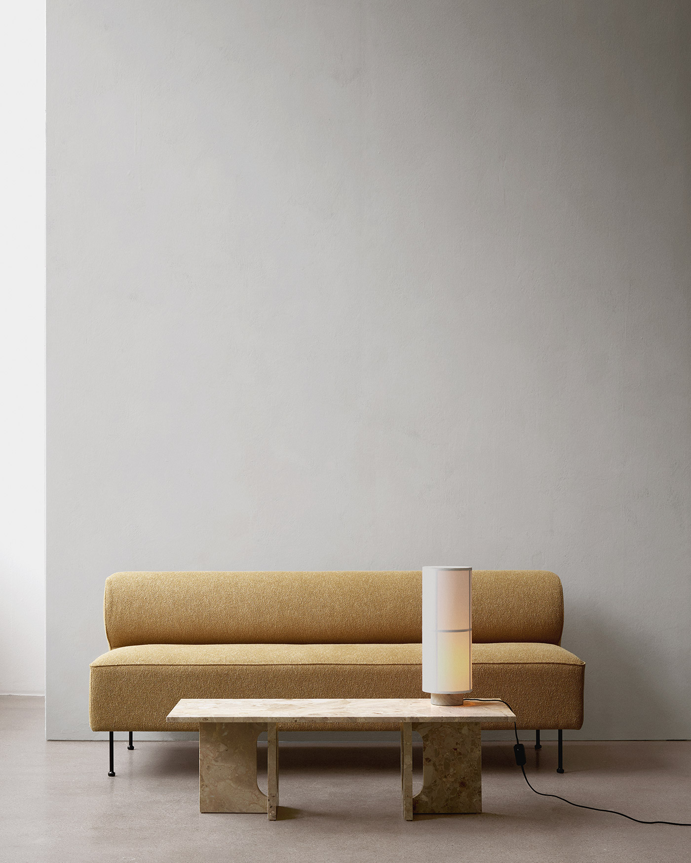 Modern minimal sofa against grey wall