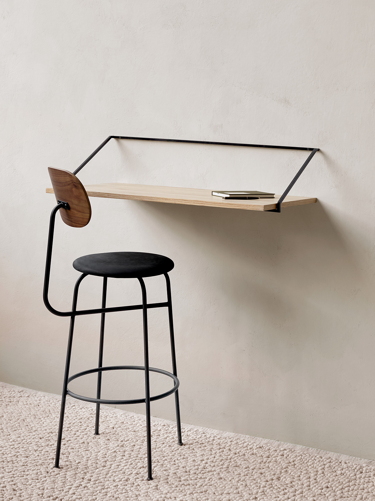 Rail desk in oak, Afteroom bar chair in black, Gravel rug in ivory by Menu