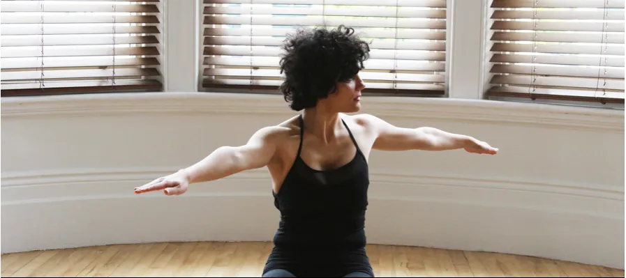 Pilates kneeling pose on matt facing forward.