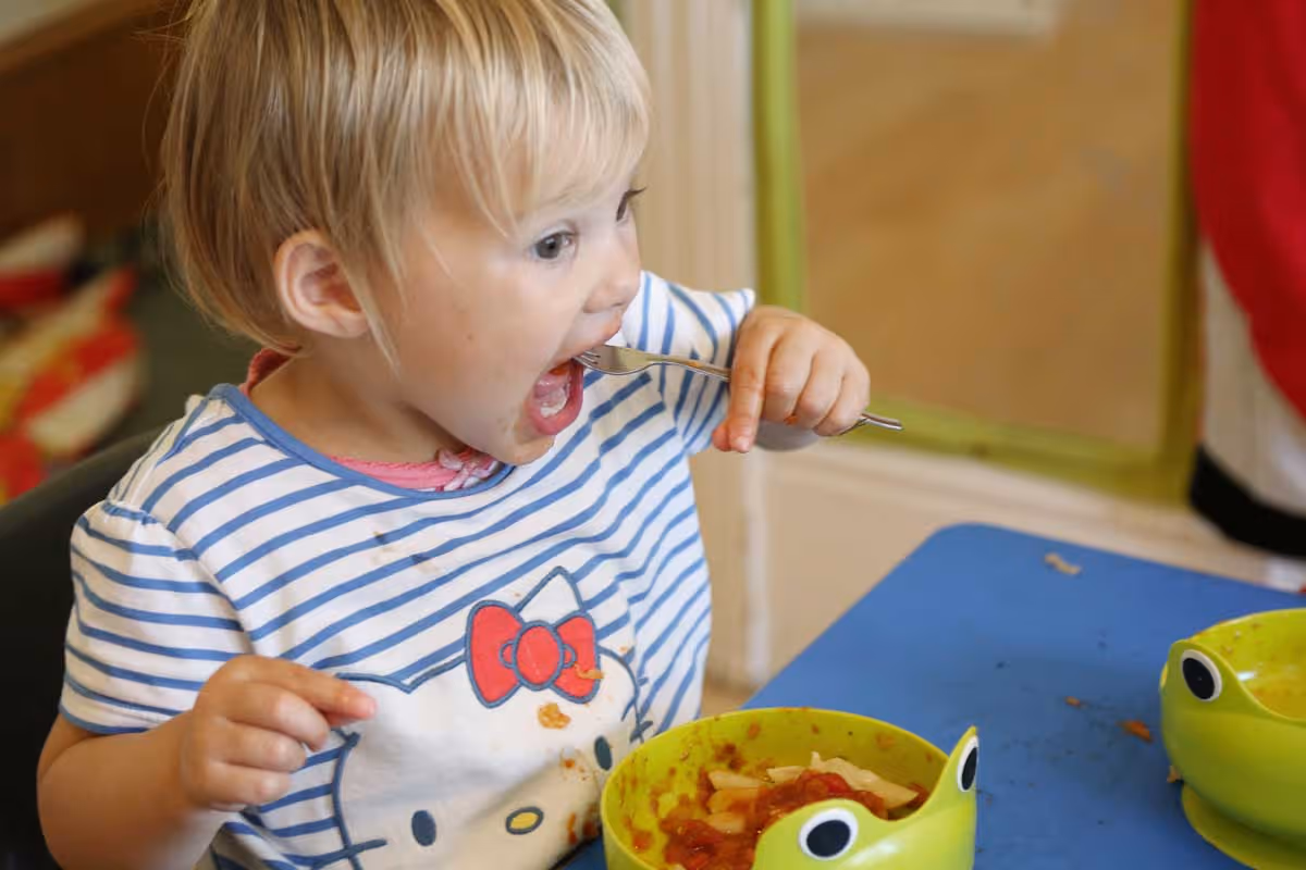 photo of a child eating lunch