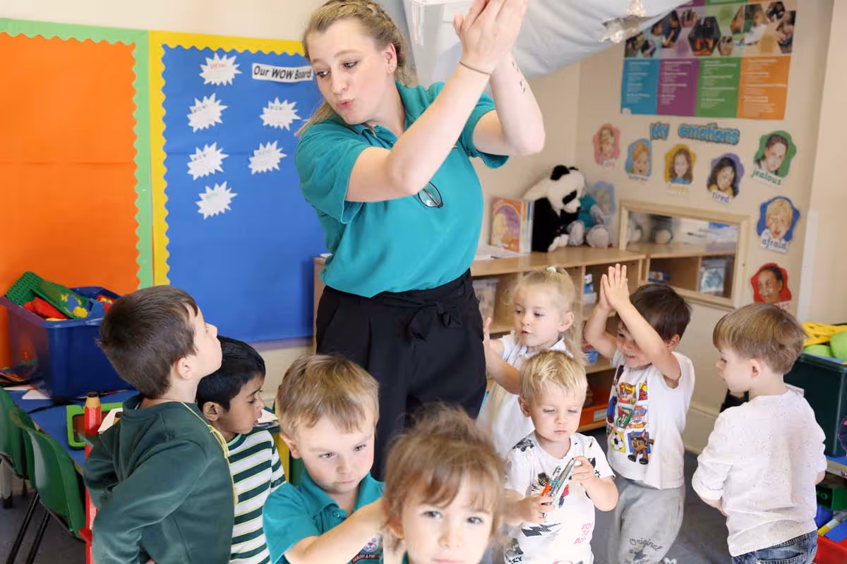 photo of children dancing with their child-minder