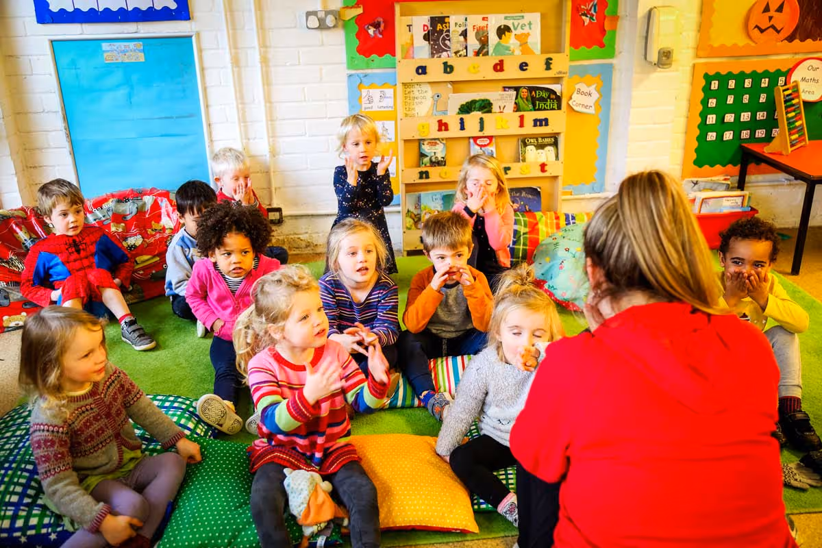 photo of children talking to a child-minder