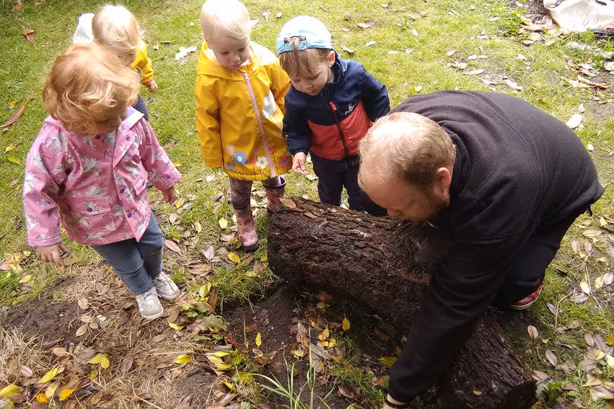 photo of children learning in the woods