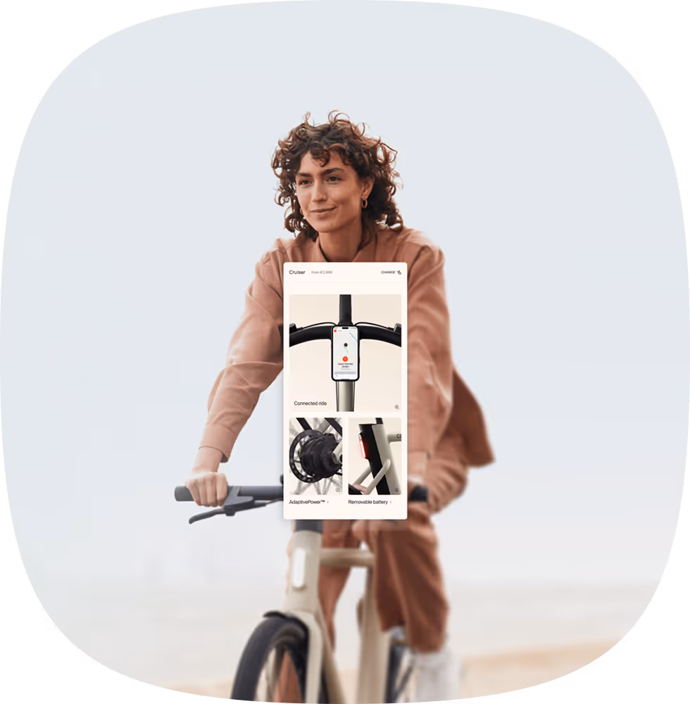 Mobile mockup of Cowboy ecommerce product page on top of a woman riding a bicycle