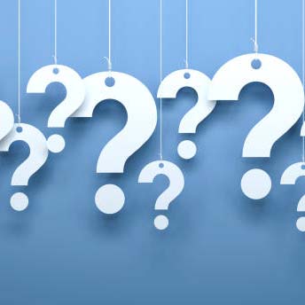 Image of paper question marks hanging from strings