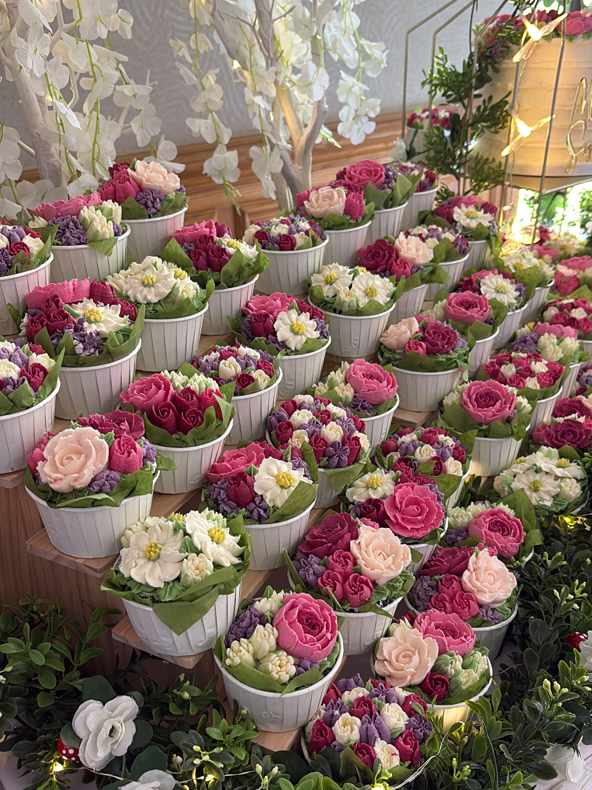 Colourful wedding cupcake garden closeup