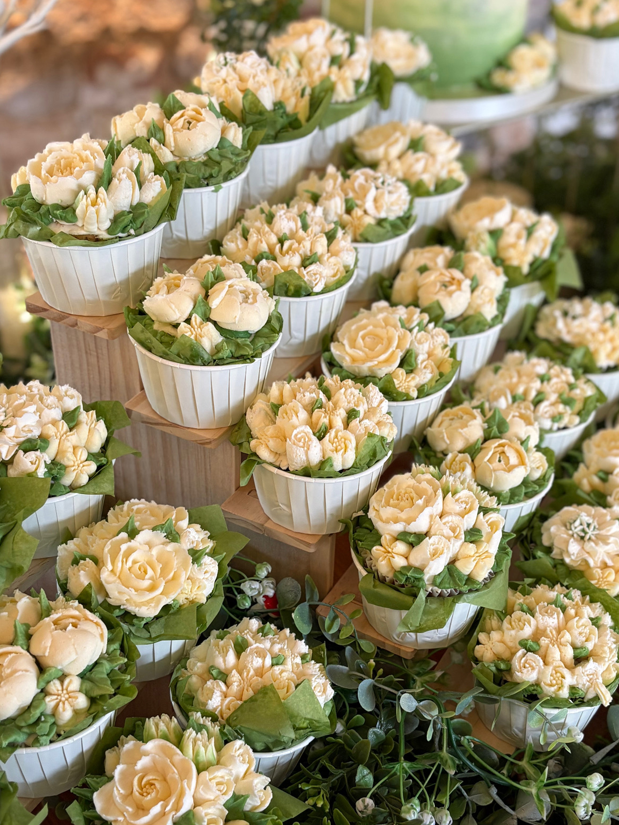 Cupcake wedding garden in white buttercream closeup