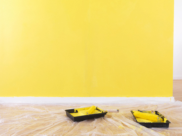 Paint rollers on the floor.