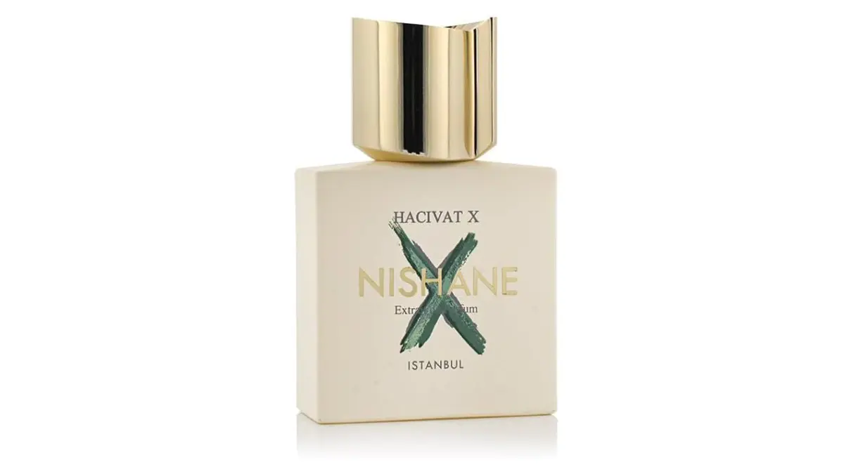 Flacone bianco del profumo Hacivat X di Nishane Istanbul, con una X verde dipinta e un lussuoso tappo dorato, icona dei profumi di nicchia