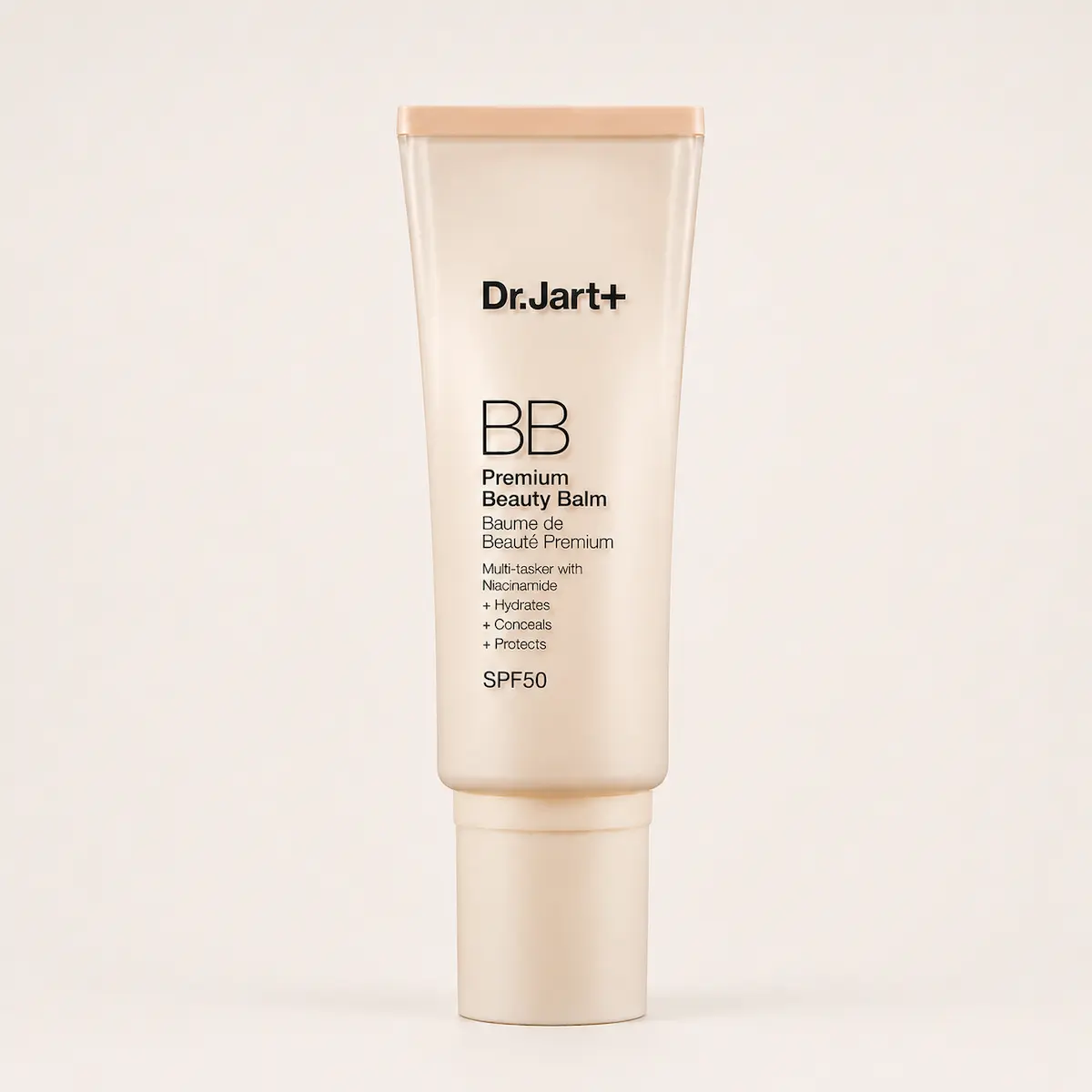 Dr.Jart+ Premium BB Beauty Balm SPF 50 su sfondo beige chiaro, BB cream viso con niacinamide e finish naturale