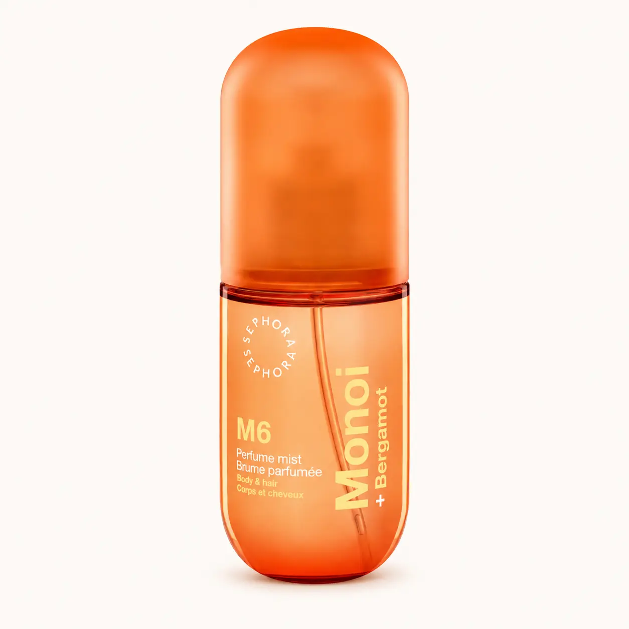 Sephora Collection Monoi + Bergamotto body mist arancione su sfondo chiaro