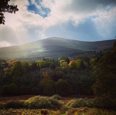 Light strikes an autumnal glencree valley photo by alan gilsenan