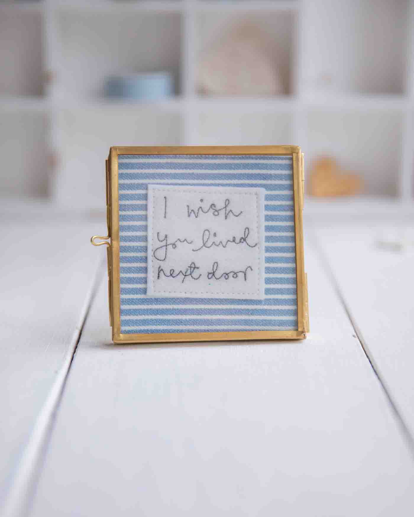 colourful square framed embroideries 