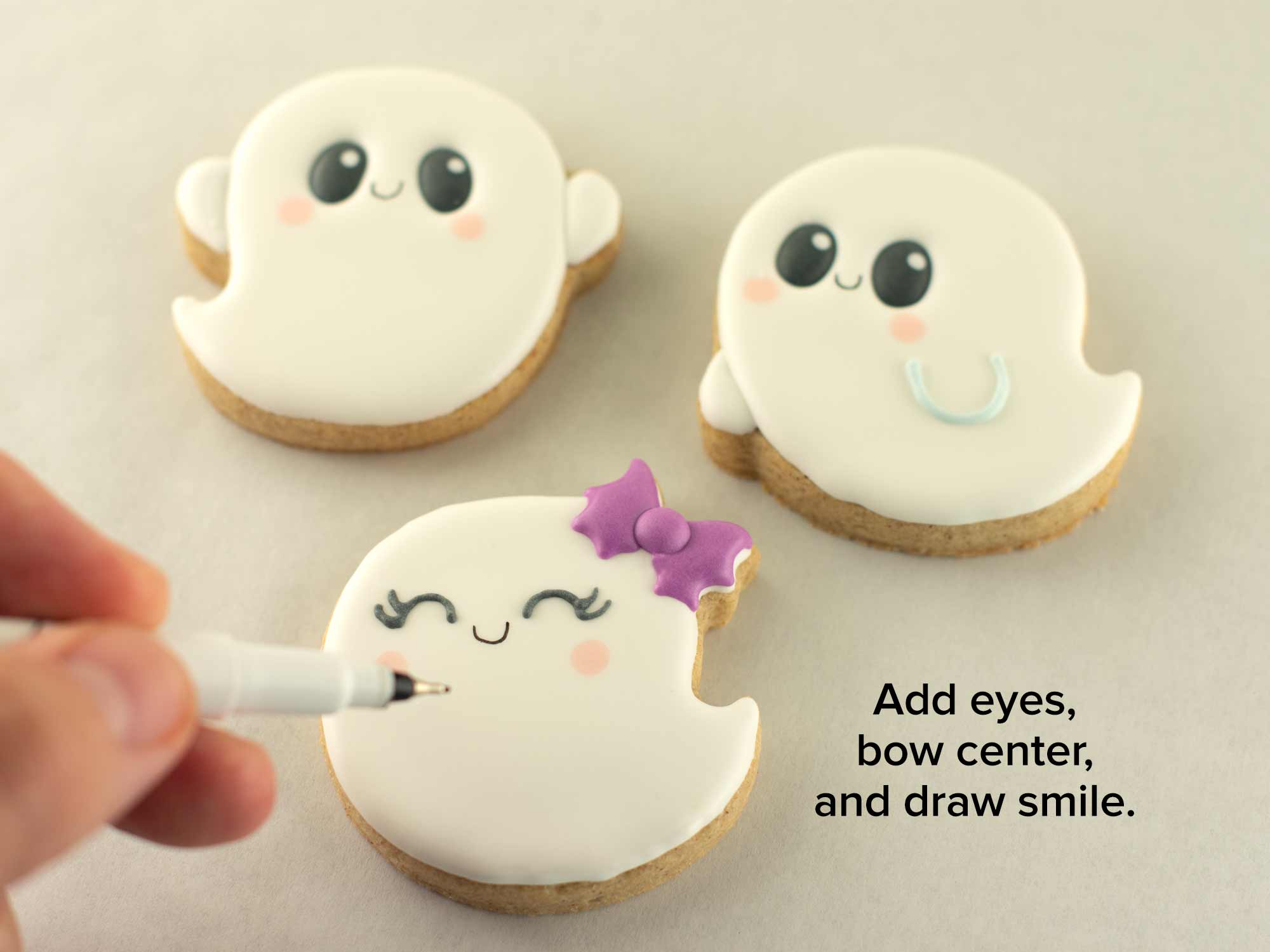 Halloween cookie decorating of simple ghost cookies