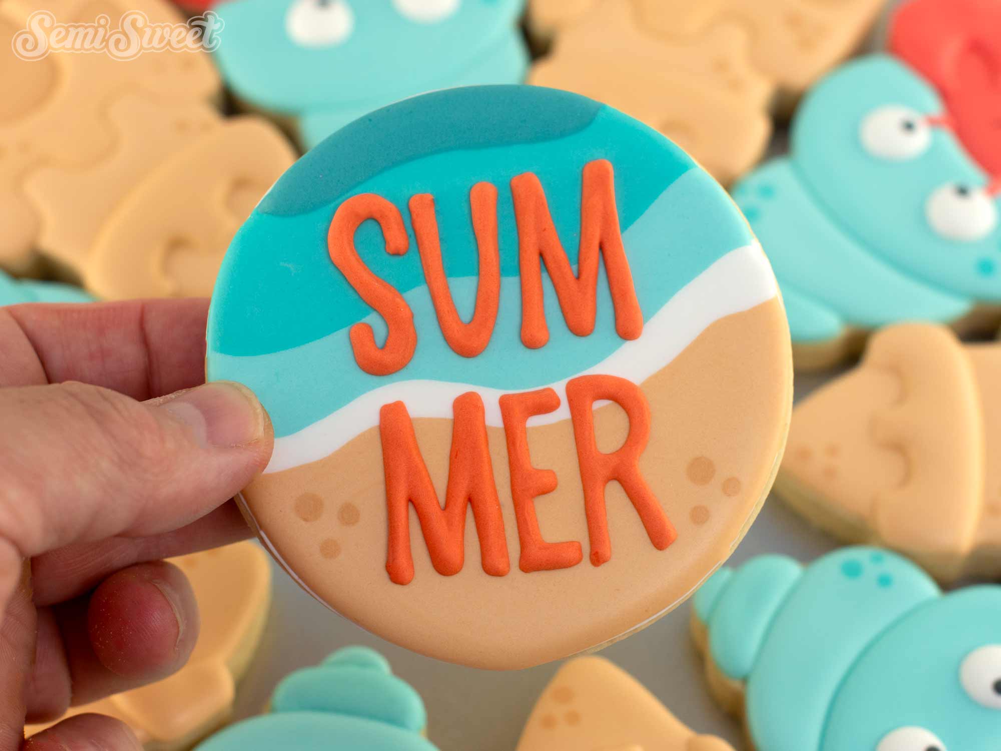 beach wave cookie with the word Summer on it