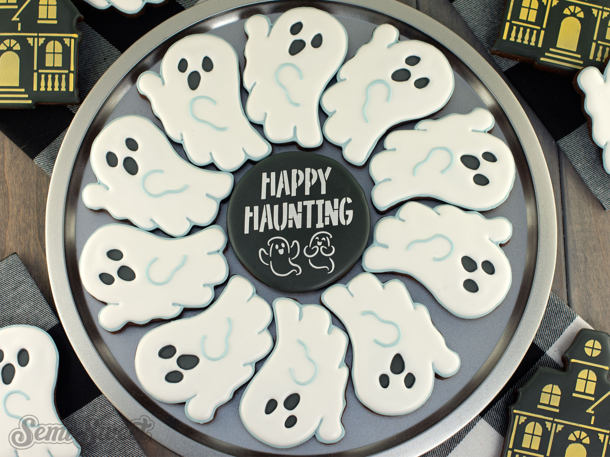 a cute ghost cookie platter with Happy Haunting in the middle
