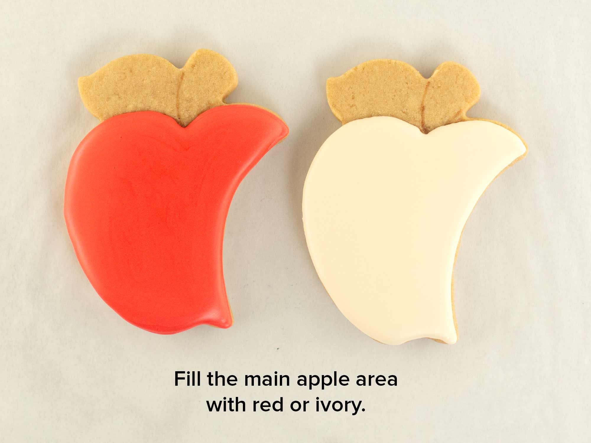 decorating apple cookies with royal icing