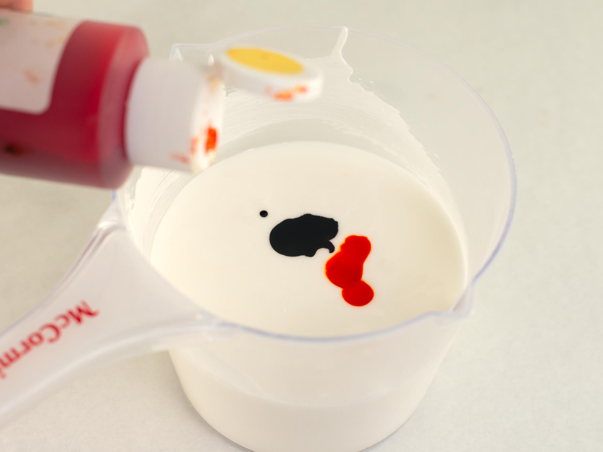adding a small amount of Americolor food gel color to royal icing