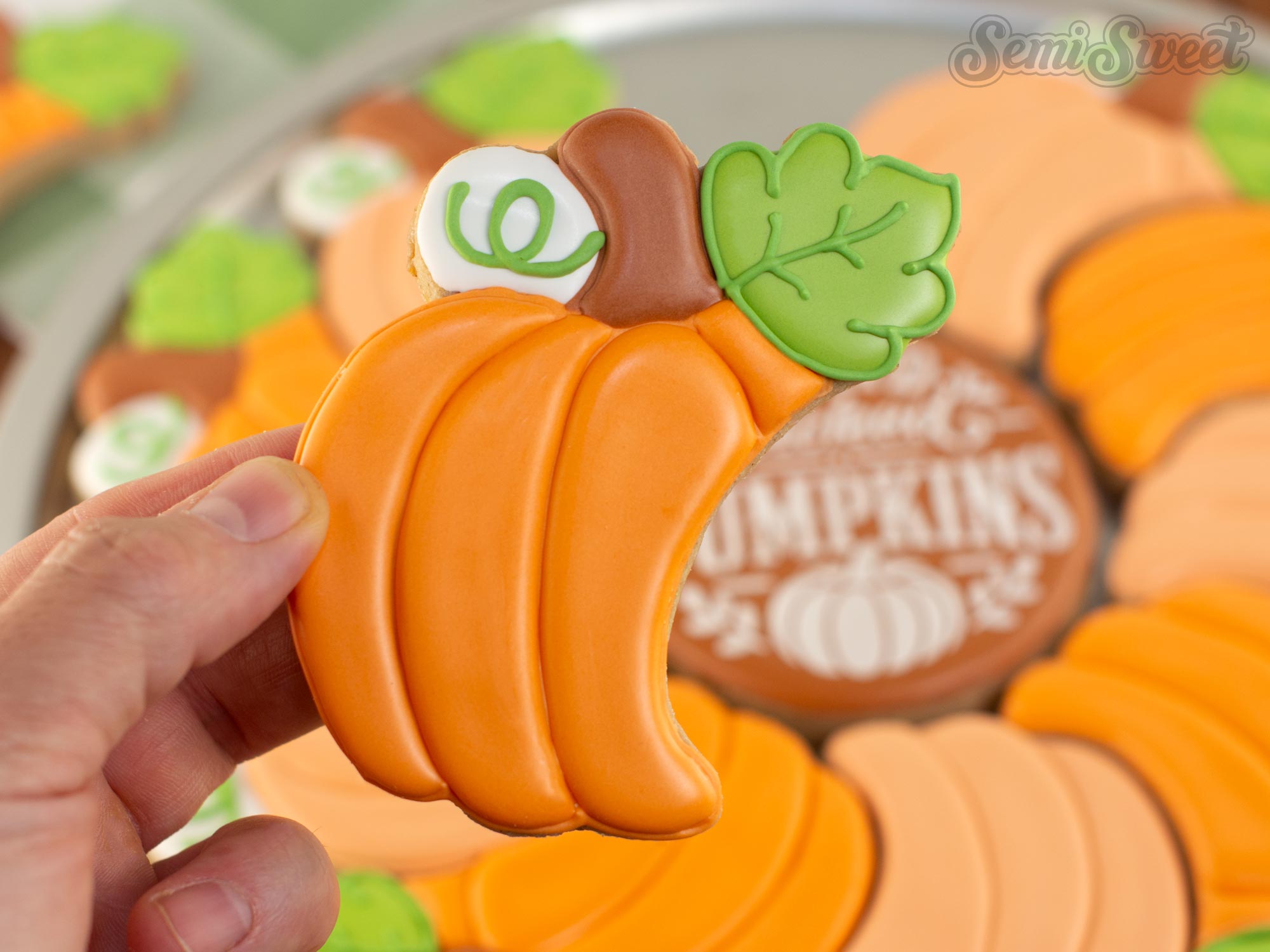 finished pumpkin cookie decorated with royal icing