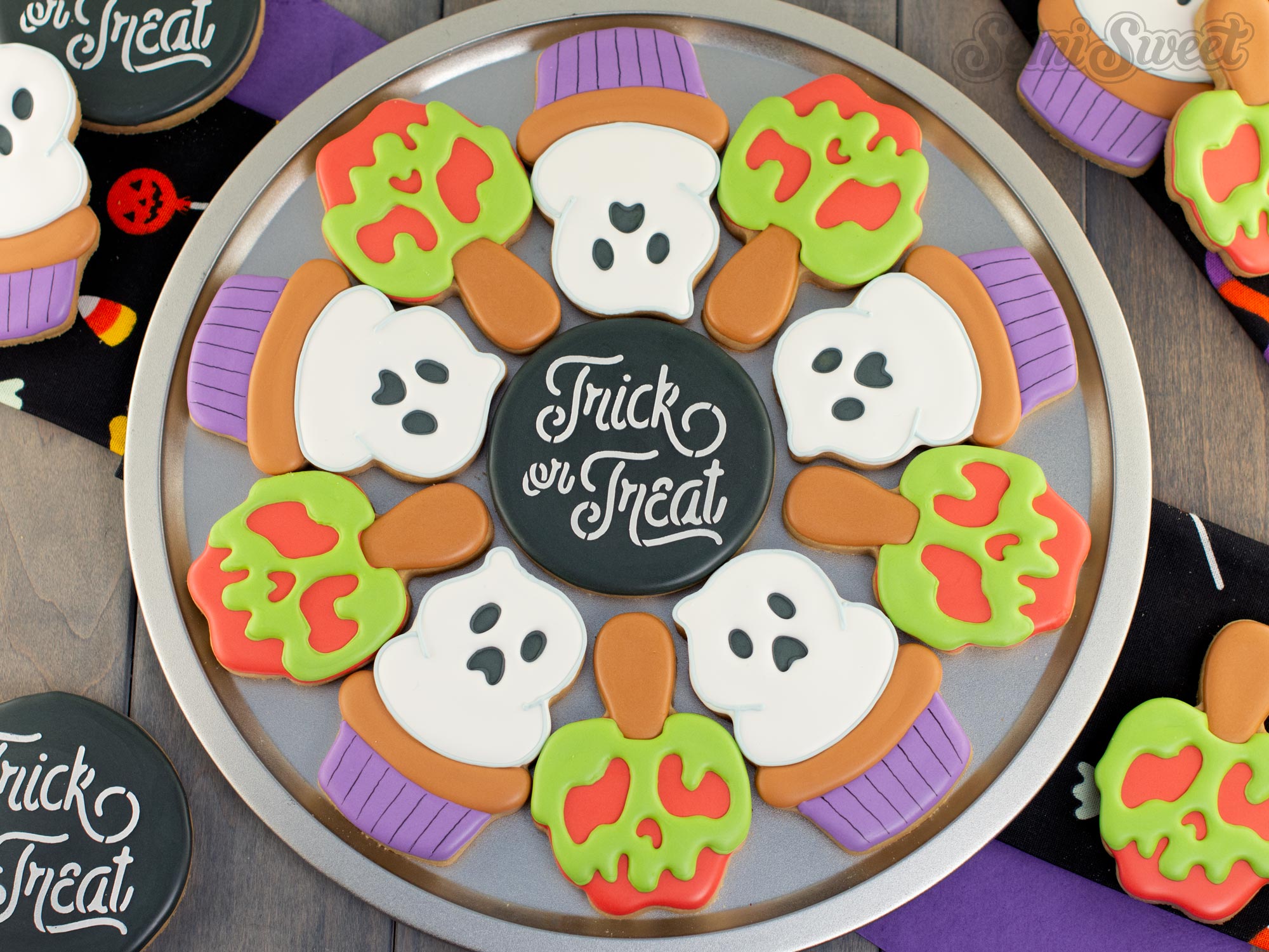 Poisoned caramel apple and ghost cupcake cookies decorated with royal icing for Halloween