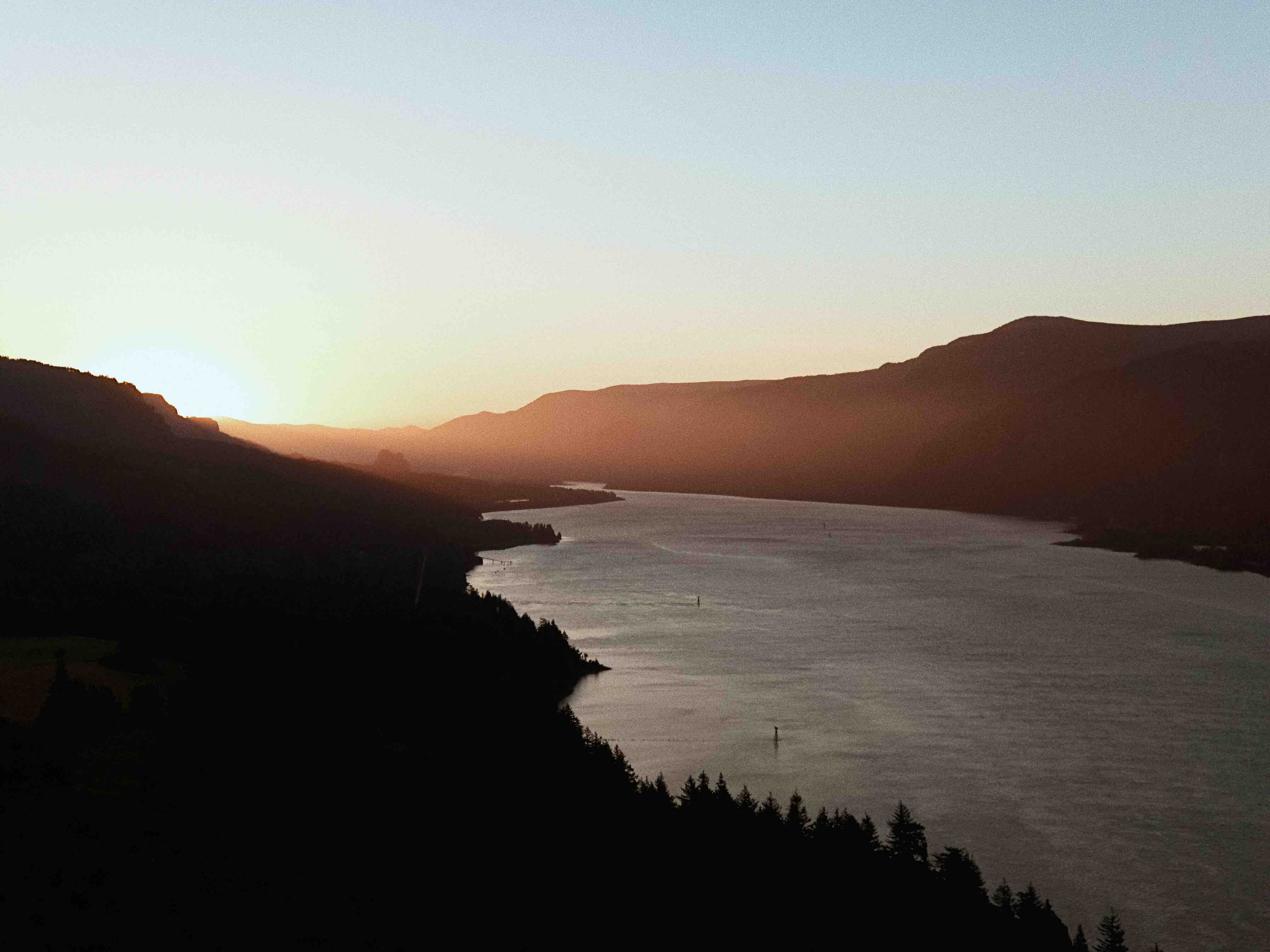 Columbia River Gorge near Portland at sunset with silhouetted hills and the river winding into the distance