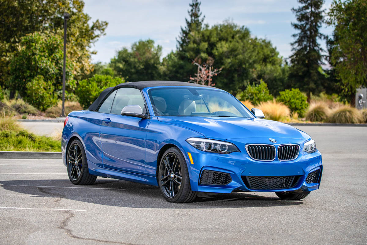 Blue BMW convertible photographed in a parking lot — professional dealer car gallery photo for online car buying listings