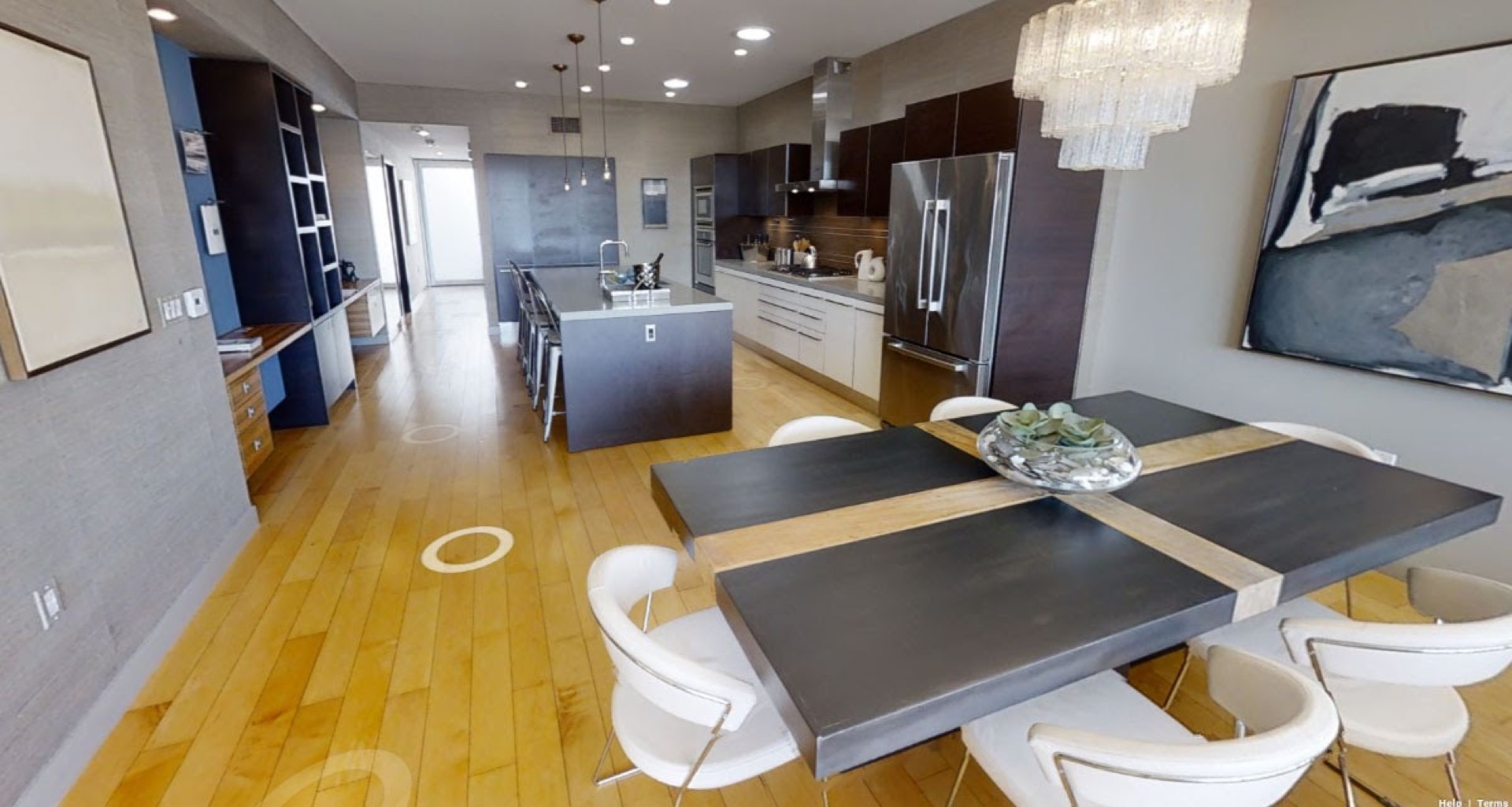 360-degree virtual tour screenshot of a modern open-plan kitchen and dining area, replacing traditional open houses in post-Covid real estate marketing