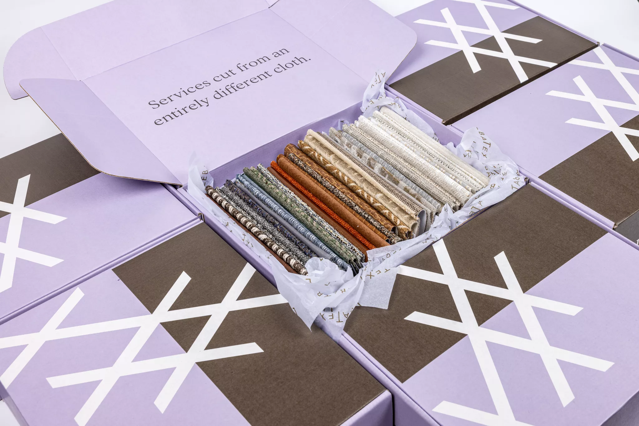 Fabric swatch box mailer — sampling strategy that lowers ecommerce return rate for textile brands.