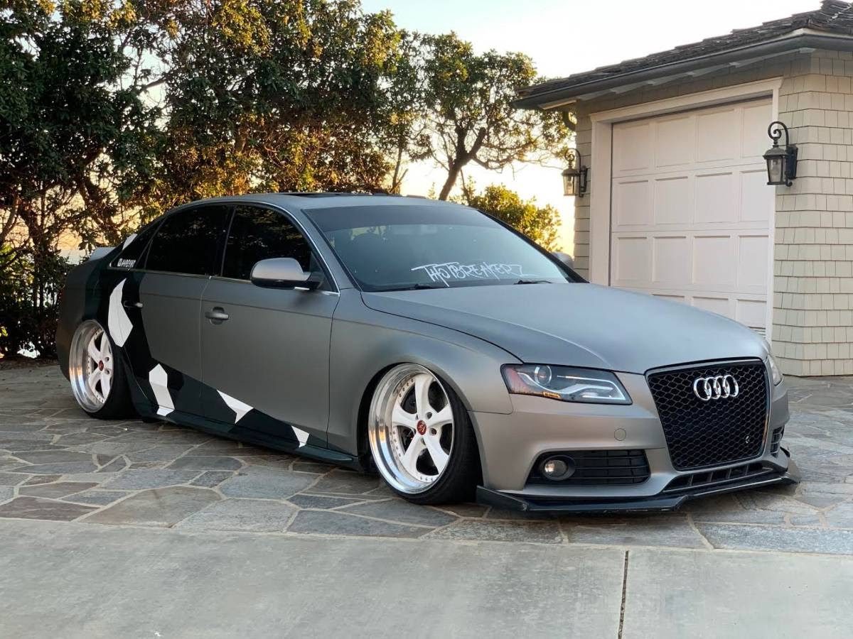 Modified matte gray Audi A4 with camo wrap listed on Craigslist