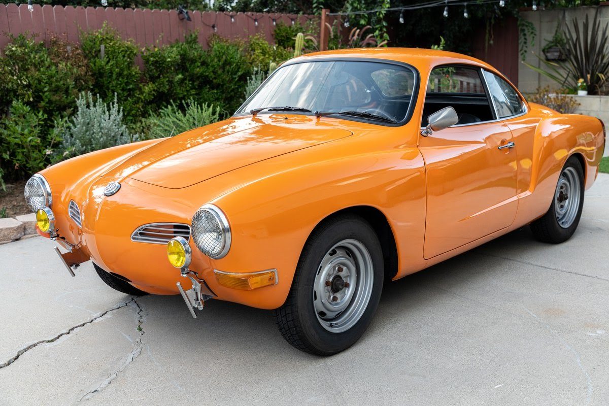 Orange vintage Volkswagen Karmann Ghia listed on Bring a Trailer