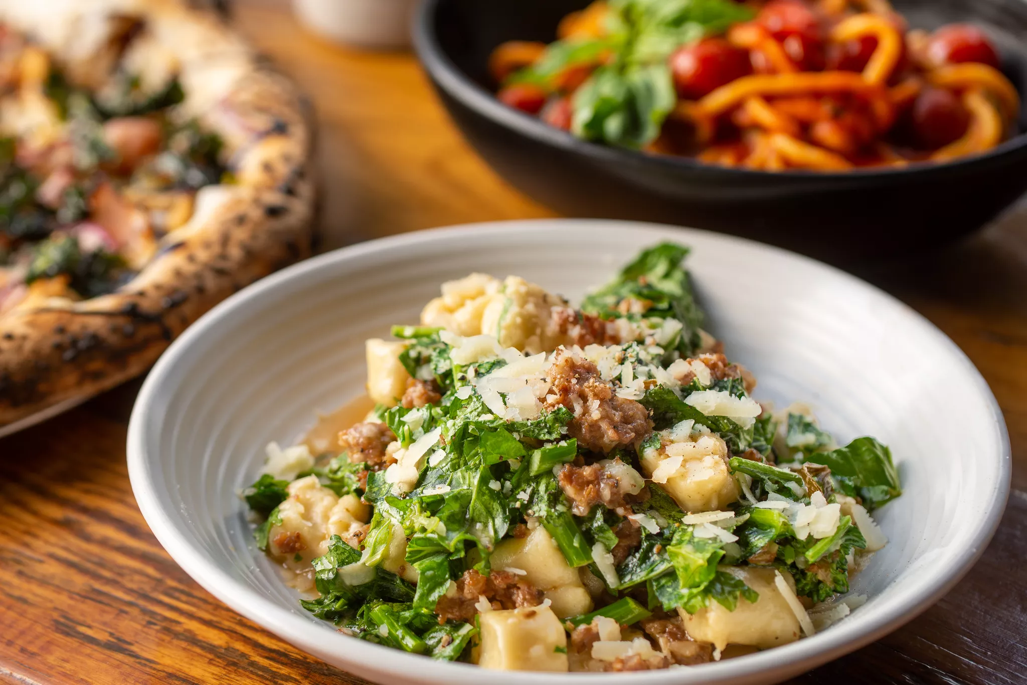 Gnocchi with sausage and greens, a source frame for image to video AI menu clips.