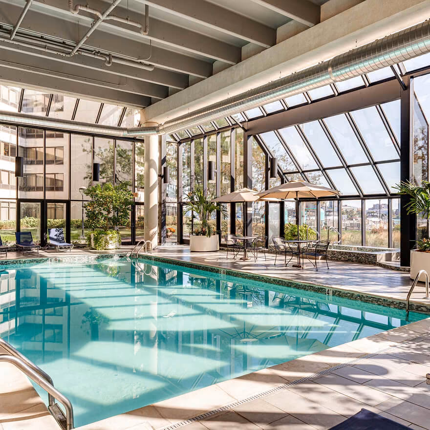 Professional real estate photography showcasing indoor pool amenity for property listing marketing