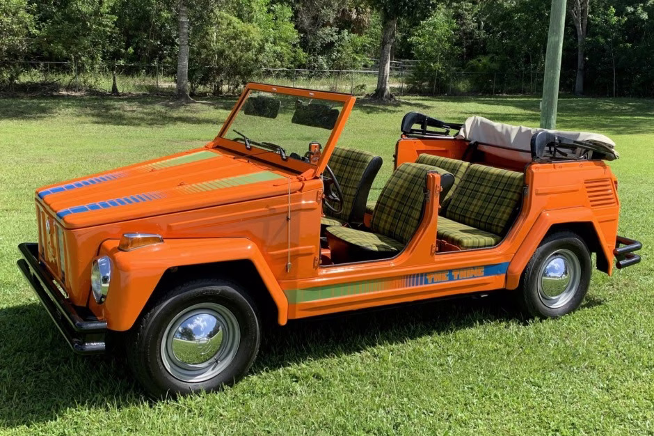 Orange 1973 Volkswagen Thing parked on grass