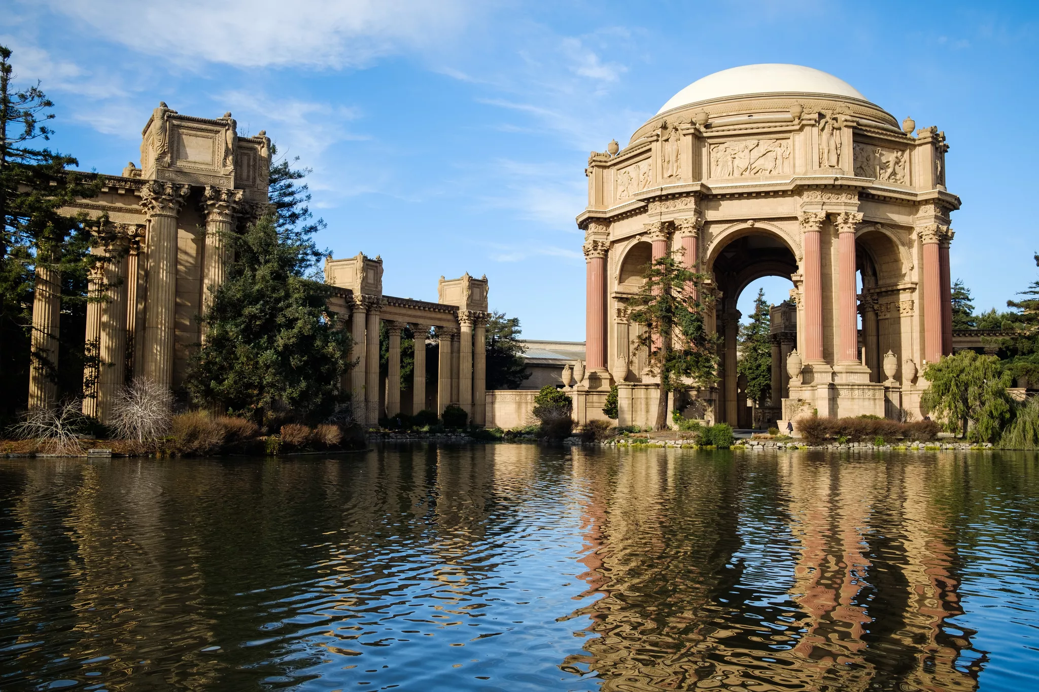 Domed rotunda and colonnade mirrored in a lagoon, classic architectural photography framing