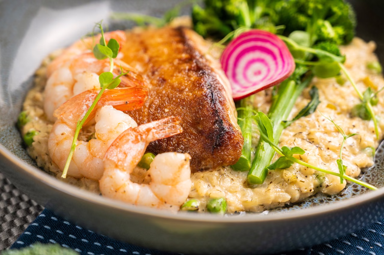 Plated risotto with prawns, a commissioned restaurant photograph rather than a stock image