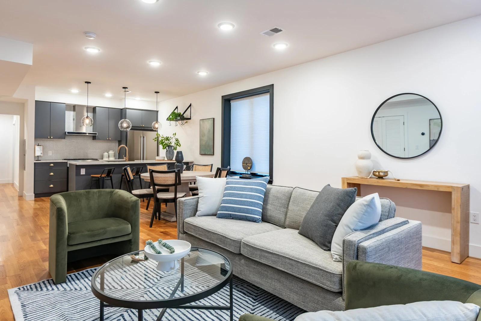 Open-plan living room and kitchen photographed from the room's corner