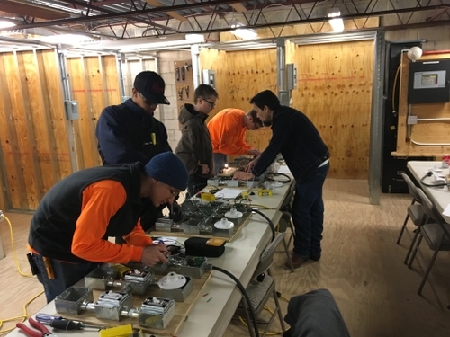 Apprentices learning about how to wire circuits and other devices