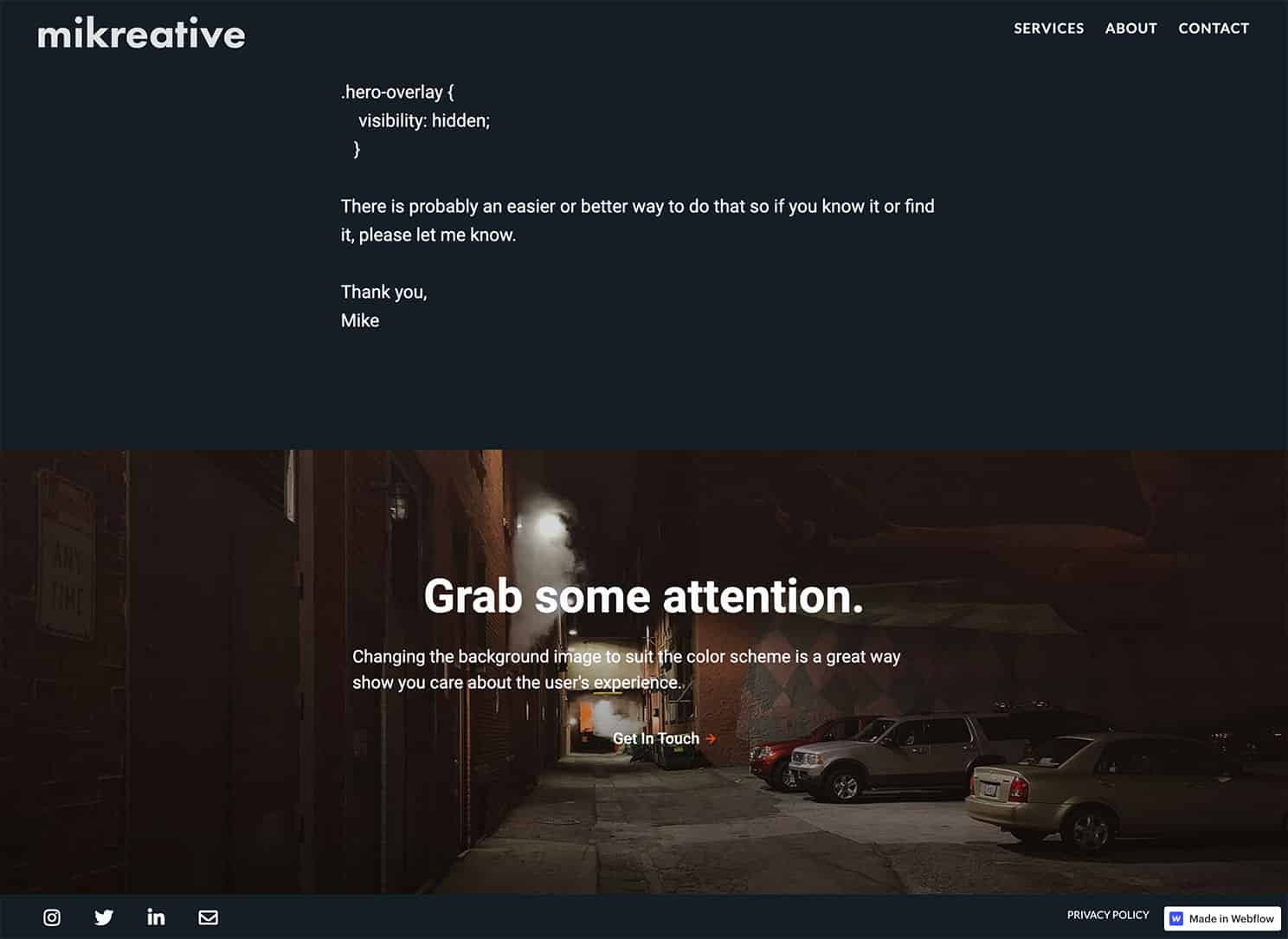 In dark mode the image is changed to a night scene of an alley parking lot. The image is on a navy background.