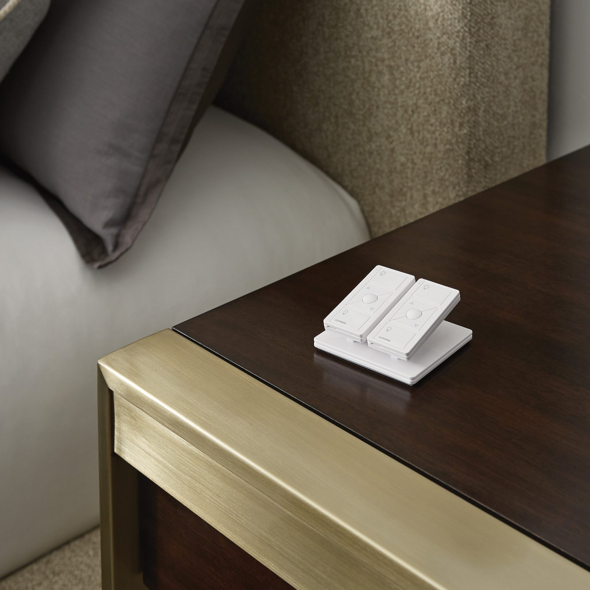 Lutron Pico remotes on a bedside table