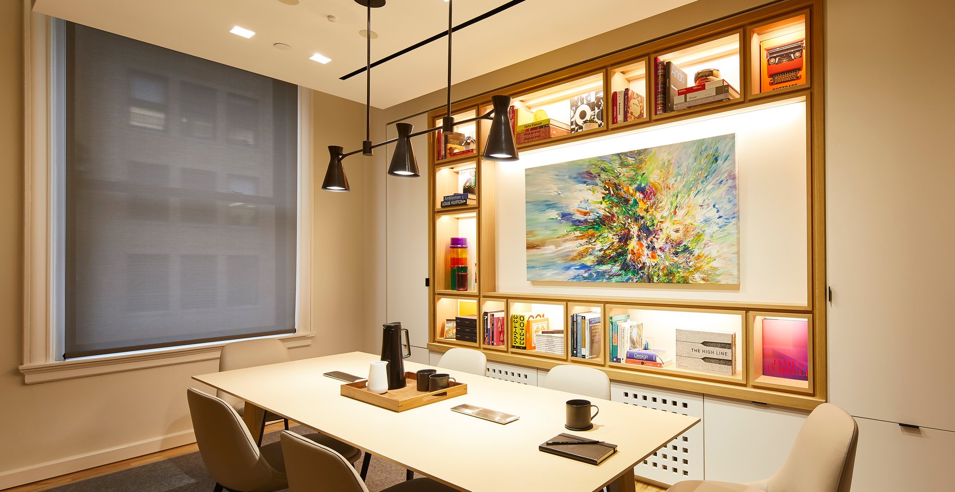 Room with art and decorative elements picked out by accent lighting