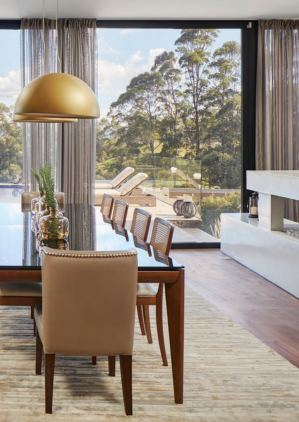 Lutron HomeWorks lighting control in a contemporary dining and living space