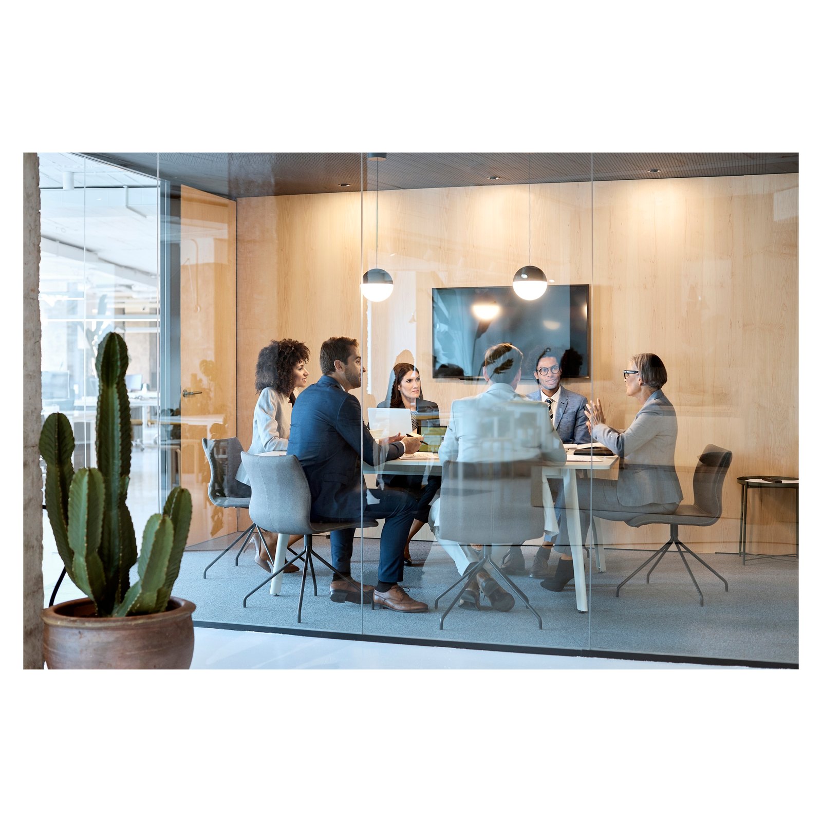 Owner's representative and project team reviewing technology scope for a private residence